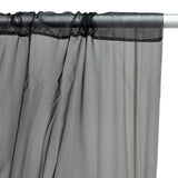Sheer gray curtain panel with a black lace trim.