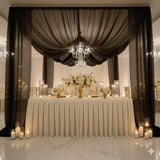 Elegant wedding reception decor with floral arrangements and candlelight.
