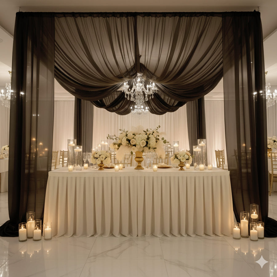 Elegant wedding reception decor with floral arrangements and candlelight.