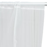 Sheer white curtain panel hanging on a rod