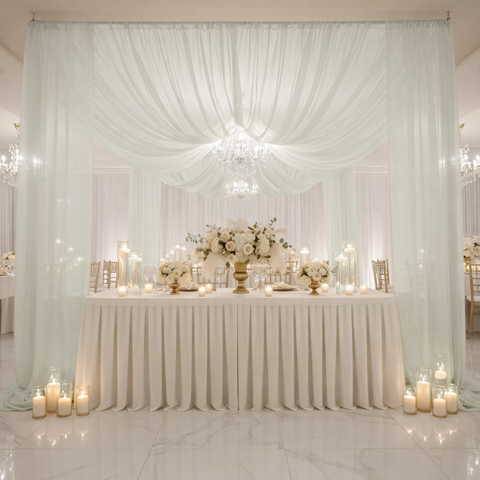 Elegant wedding reception setup with floral arrangements and soft lighting.