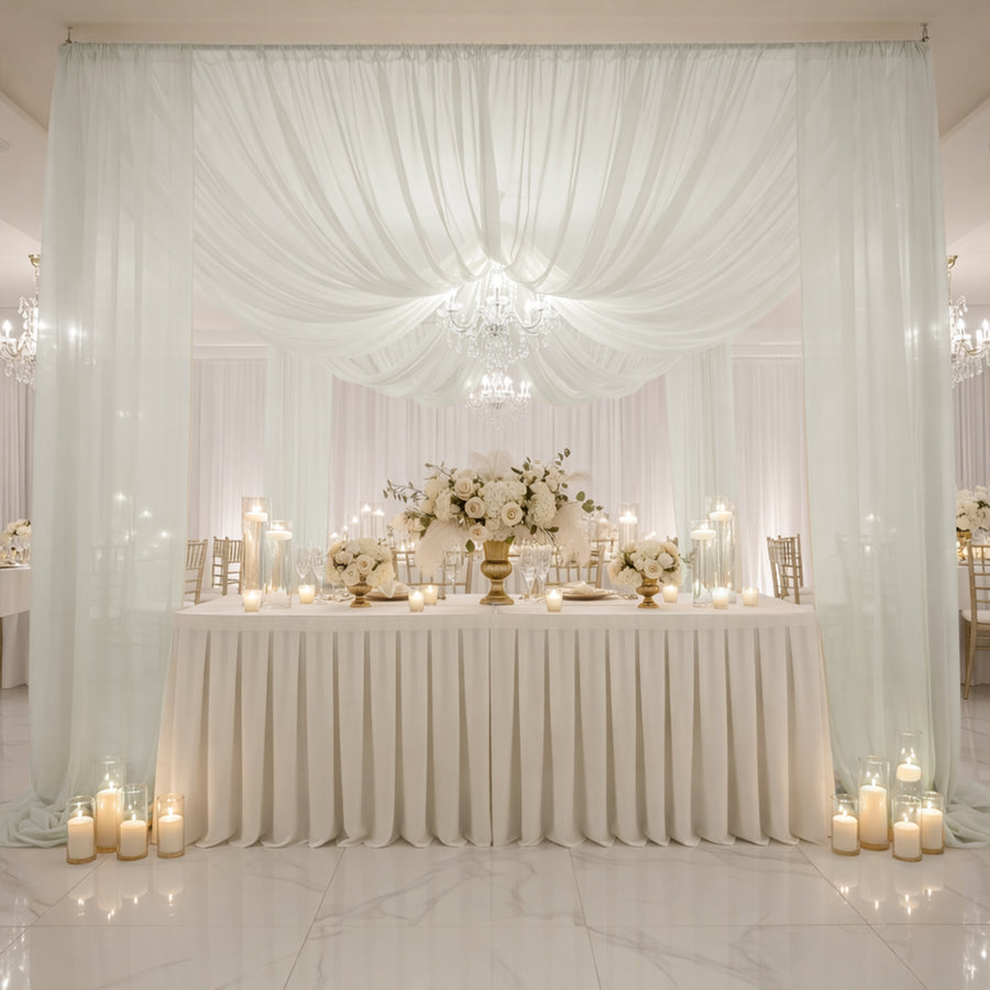 Elegant wedding reception setup with floral arrangements and soft lighting.