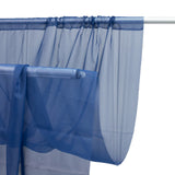 Sheer navy curtain draped on a rod, showcasing its flowy fabric. #whtbkgd