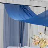 Blue drapery fabric elegantly arranged for event decor setup.