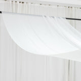 White sheer curtain draping elegantly over a black rod