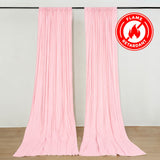 Pink flame retardant draped curtains with hanging rod in a studio room