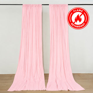 Pink flame retardant draped curtains with hanging rod in a studio room