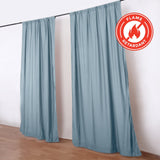 Flame retardant blue curtains on rod in a minimalist room