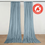 Blue flame retardant curtains hanging on a wall with fire-resistant label
