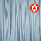 Light blue flame-retardant curtain draping gracefully. #whtbkgd