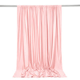 Pink satin curtain draped on a metal rod, elegant studio backdrop