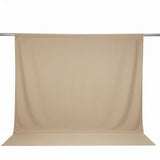 Beige seamless backdrop on a photography background stand