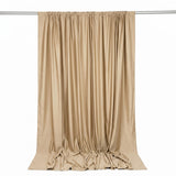 Beige satin curtain panel hanging on rod, elegant draped backdrop