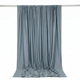 Gray satin curtain draped on rod, elegant fabric backdrop