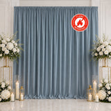 Elegant blue wedding backdrop with white floral arrangements and candle lanterns