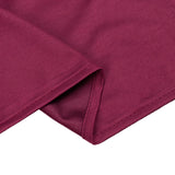 Maroon ribbed fabric close-up with folded hem detail
