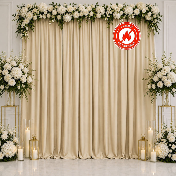 Elegant white floral wedding backdrop with gold curtains and candles
