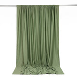 Olive green draped curtain on rod, elegant flowing fabric backdrop