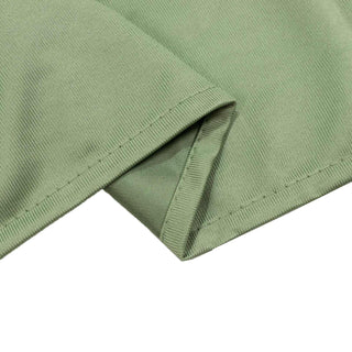 Close-up of sage green ribbed knit fabric hem stitching