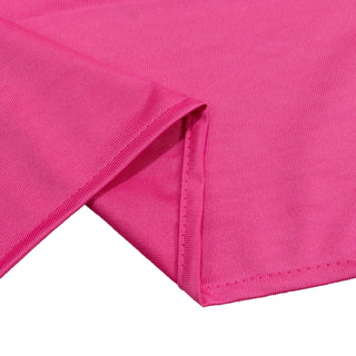 Bright pink ribbed fabric textile close-up with folded edge