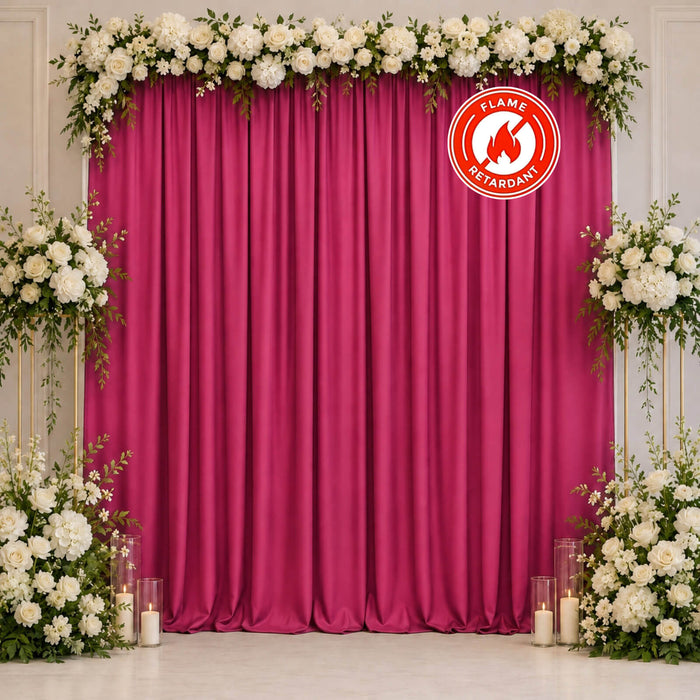 Floral magenta wedding backdrop with white roses and fire-retardant curtain