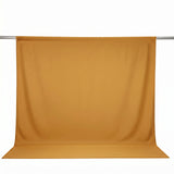 Gold backdrop curtain on a studio backdrop stand, isolated on white