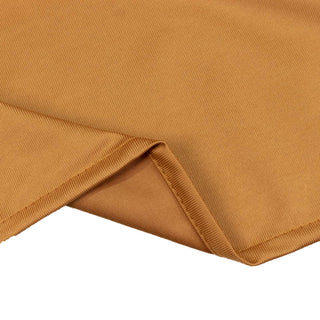 Camel ribbed fabric close-up with folded hem detail