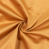 Golden ribbed fabric swirls close-up texture background#whtbkgd