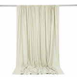 Cream satin curtain panel hanging on rod with elegant draped folds