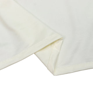 Folded ivory ribbed fabric texture close-up on white background