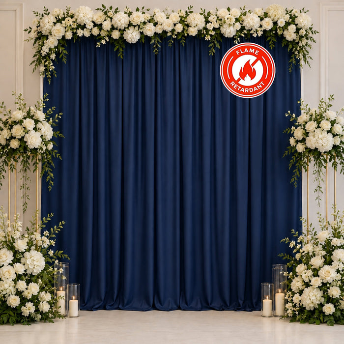 Navy blue floral wedding backdrop with white roses and candles