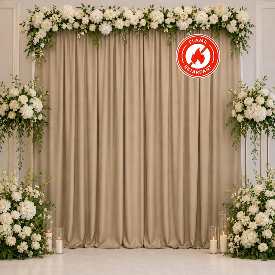 Elegant floral wedding backdrop with white roses and beige drapes, flame retardant
