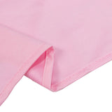 Pink ribbed fabric close-up with folded hem detail