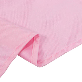 Pink ribbed fabric close-up with folded hem detail