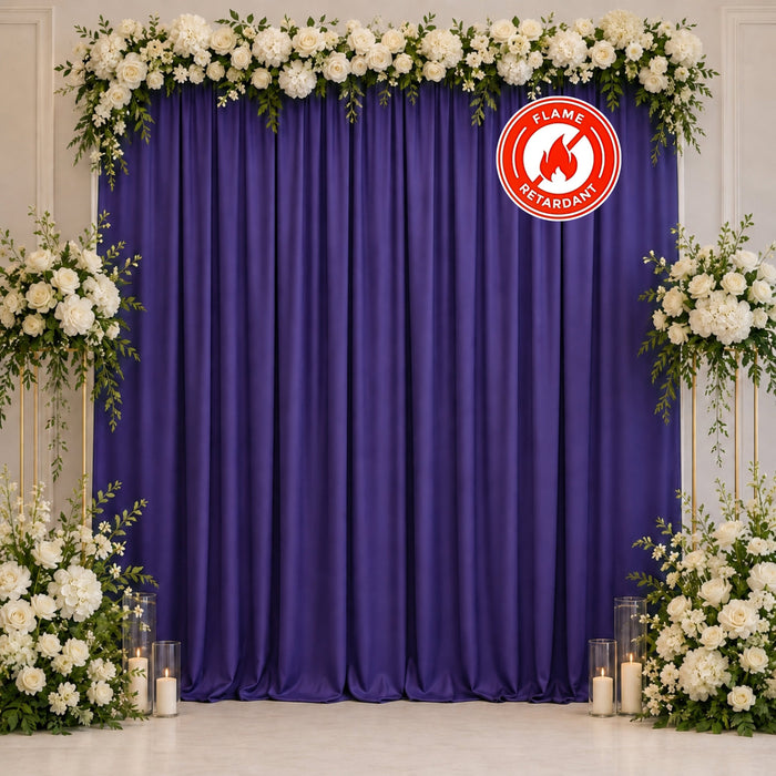 Purple floral wedding backdrop with white roses and candles