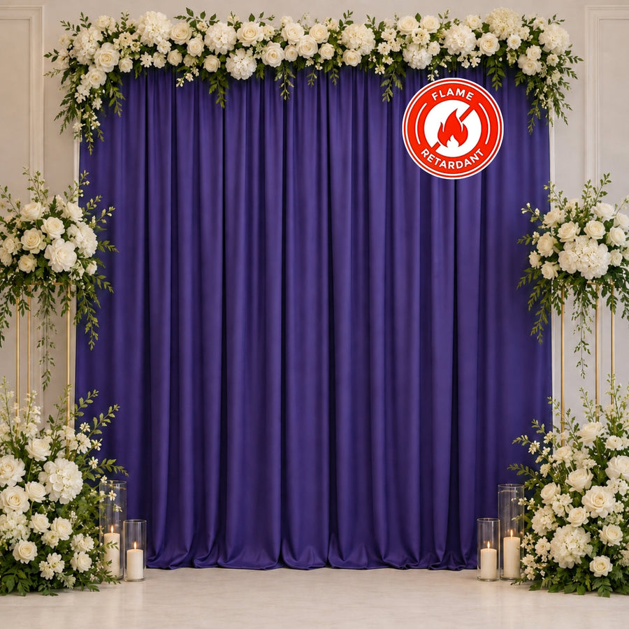 Purple floral wedding backdrop with white roses and candles