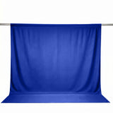 Blue photography backdrop curtain on a metal support stand