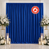 Blue flame-retardant event curtain with white floral decor and candles
