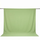 Light green seamless photography backdrop with hanging crossbar