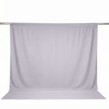 Light gray window curtain panel on a rod with floor-length drape