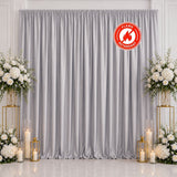 Silver flame retardant wedding backdrop with floral arrangements and candles