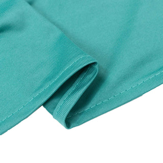 Turquoise ribbed knit fabric close-up texture with folded hem