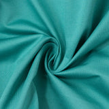 Teal knit fabric texture with swirl folds close-up#whtbkgd