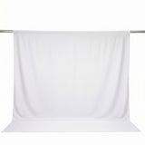 White sheer curtain panel on a rod, minimalist window treatment