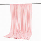 Pink sheer draped curtain on a silver rod, studio product photo