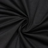 Black ribbed fabric texture with soft spiral folds and draped pattern