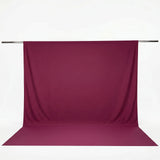 Burgundy seamless backdrop curtain on support rod for photography#whtbkgd