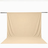 Beige seamless backdrop curtain on support rod for photography studio#whtbkgd
