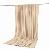 Beige satin curtain panel draped on rod, elegant home decor backdrop