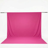 Pink photo backdrop with seamless floor and hanging support rod#whtbkgd